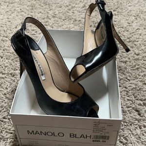 Beautiful Manolo Blahnik Black patent leather sling backs.